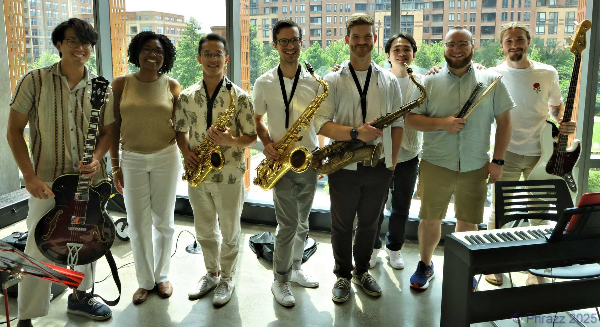 The HQBlue Jazz Ensemble — eight musicians with guitar, saxophones, bass and drumsticks